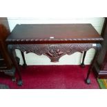 AN IRISH STYLE CARVED MAHOGANY SIDE OR HALL TABLE, 
with gadroon edge,