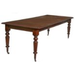 A MAHOGANY DINING TABLE,
Victorian and later, with two spare leaves and a moulded edge,