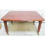 A LATE VICTORIAN MAHOGANY TELESCOPIC DINING TABLE,
with two spare leaves,