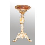 A CAST IRON BIRD BATH, 
with bowl shaped top, on an ornate stem and tri-pod base, 29in (74cm)h.