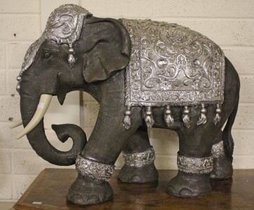 A COMPOSITION MODEL OF AN INDIAN ELEPHANT, 
the saddle and head dress with paste set crystals,