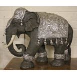 A COMPOSITION MODEL OF AN INDIAN ELEPHANT, 
the saddle and head dress with paste set crystals,