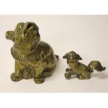 A HEAVY BRASS MODEL OF A PUG DOG, 
8in (20cm); together with a Chinese brass model of a temple lion,