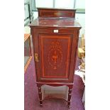 AN EDWARDIAN INLAID WALNUT MUSIC CABINET,
with single door and stretcher shelf,