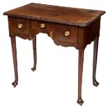AN EIGHTEENTH CENTURY MAHOGANY OR RED WALNUT LOW BOY, 
the rectangular moulded top,