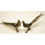 AN ATTRACTIVE PAIR OF WHITE METAL TABLE ORNAMENTS, 
each in the form of a pheasant, 24in (31cm).