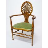 A WALNUT ARTS AND CRAFTS CHAIR, 
the pierced shell back with floral panel,