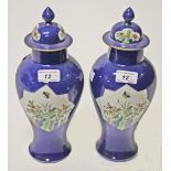 A PAIR OF LATE 19TH CENTURY SAMSON POWDER BLUE AND FAMILLE ROSE VASES AND COVERS,