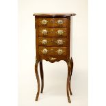 A SERPENTINE SHAPED WALNUT FRENCH PETIT COMMODE, 
with four drawers,