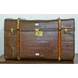 AN OLD CANVAS COVERED CANE AND BRASS BOUND STEAMER TRUNK, 
32.25in (82cm).