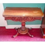 A MAHOGANY FOLD OVER TEA TABLE, 
in the Victorian style on turned stem with quadruple pod,