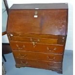 A 19TH CENTURY MAHOGANY BUREAU, the slope front opening to reveal a nicely fitted interior,