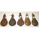 FIVE EMBOSSED COPPER POWDER FLASKS, 
19th century, various designs, animals, game etc.