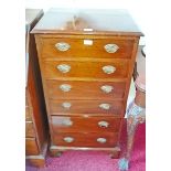 A SMALL MAHOGANY TALL BOY, 
with six long drawers and raised on bracket feet,