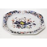 A heavy ironstone meat platter, 19th century, in the Imari style with flower decoration,