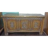 A 17TH CENTURY STYLE OAK LIFT TOP COFFER CHEST, with triple panel front, 41.