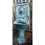 A CAST BRONZE WALL OR GARDEN FOUNTAIN, 
the winged and arch back crested with a flower,