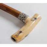 A FINE JAPANESE SHIBAYAMA IVORY CANE, signed, the handle overlaid with mother-o-pearl insects,