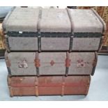 THREE OLD CANVAS AND METAL BOUND STEAMER TRUNKS, 
an old suitcase and an oblong wooden bench.