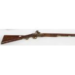 A GEORGIAN FLINT LOCK MUSKET, 
with three quarter walnut stock, 26in (67cm),