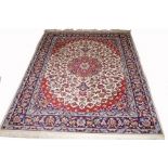 A PERSIAN CARPET, 
with central red floral medallion,