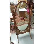 AN INLAID MAHOGANY SWING FRAME CHEVAL MIRROR, with oval plate and brass urn finials, 57.