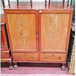 A GEORGE IV PERIOD MAHOGANY LINEN CUPBOARD, 
with two panel doors, enclosing three slides,