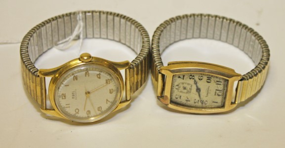 A HEAVY GOLD EBEL AUTOMATIC WRIST WATCH, 
water proof and with shock absorber,