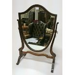 A SMALL GEORGIAN STYLE SHIELD SHAPED DRESSING TABLE MIRROR, 
with shaped frame, 17in (43cm)w.