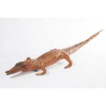 A SMALL STUFFED BABY CROCODILE, 
39in (99cm).