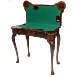 A GEORGE II PERIOD MAHOGANY CARD TABLE,
the fold over top opening to reveal a baize lined surface,