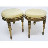 A PAIR OF LATE 19TH CENTURY GILT PIANO STOOLS, each with an adjustable padded seat,