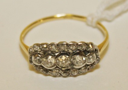 AN 18K GOLD FIVE-STONE OLD CUT DIAMOND RING
with curved mount on 18k yellow gold band,