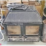 A HEAVY CAST IRON AND ENAMEL SOLID FUEL TWO DOOR STOVE ROOM HEATER, 
The Waterford 103,