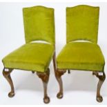 A PAIR OF WALNUT OCCASIONAL CHAIRS, 
each in the Queen Ann style with padded back and seat,