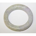 A CHINESE WHITE JADE BANGLE, 4in (10cm) diameter.