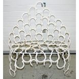 A WROUGHT IRON ARCHED BACK GARDEN SEAT, 
constructed from horse shoes, approx 36in (92cm)w.