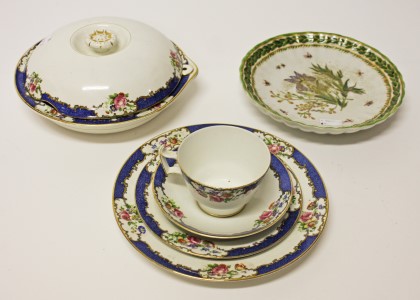 A SET OF SIX COLOURFUL FLORAL AND BUTTERFLY DECORATED PORCELAIN DESSERT PLATES, 
8.