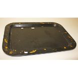 A VICTORIAN RECTANGULAR BLACK AND GILT LACQUERED PAPIER-MÂCHÉ TRAY
decorated with butterflies and