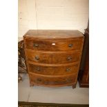 A REGENCY MAHOGANY AND SATINWOOD BANDED BOW FRONTED CHEST,