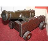 A VERY HEAVY BRONZE FLOOR CANON, 
the barrel 17in (43cm)l,