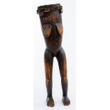 AN ANTHROPOMORPHIC DRUM ATOP A FEMALE STANDING TORSO, Makonde, Tanzania/Mozambique, wood & hide.