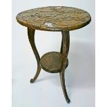 A CIRCULAR LEAF MOULDED ARTS AND CRAFTS TWO TIER OCCASIONAL TABLE, 
the top 20.5in (52cm).