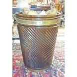 A GEORGE III IRISH STYLE BRASS BOUND MAHOGANY PEAT BUCKET, 
of spiral reeded cowpered form,