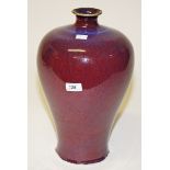 A CHINESE BALUSTER SHAPED RED TREACLE GLAZED MEIPING VASE, 
15.5in (39cm).