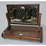 A 19TH CENTURY MAHOGANY SWING FRAME DRESSING TABLE MIRROR, 
with two bow fronted drawers,