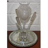 AN ATTRACTIVE GLASS AND MIRROR TABLE CENTRE, 
modelled with a central vase,