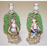 A PAIR OF DERBY STYLE PORCELAIN CANDLE STICKS, 
possibly Samson,