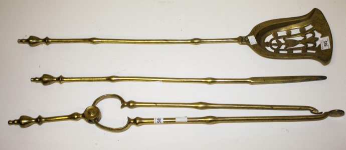 A SET OF THREE HEAVY BRASS FIRE IRONS, 
comprising shovel with pierced pan, poker and tongs,