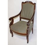 A CHARLES X MAHOGANY ARMCHAIR, 
with shaped top rail above a padded back and bow fronted seat,